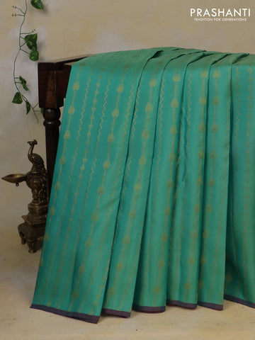 Pure kanchipuram silk saree teal blue and magenta pink with allover zari weaves and piping border