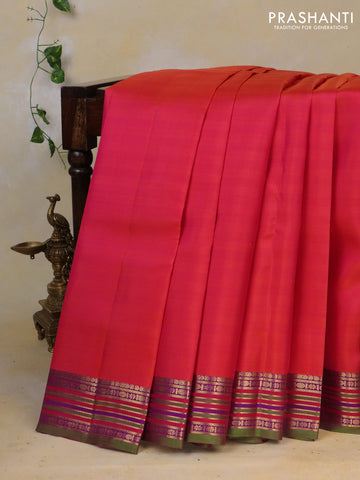 Pure kanchipuram silk saree dual shade of pinkish orange and dual shade of green with plain body and rich zari woven border