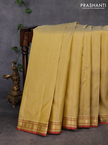 Pure kanchipuram silk saree sandal and maroon with plain body and zari woven border