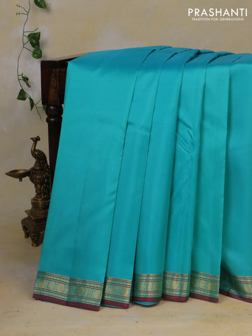 Pure kanchipuram silk saree light blue and maroon with plain body and zari woven border