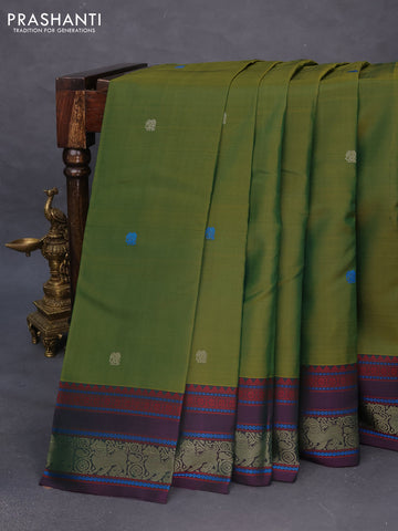 Pure kanchipuram silk saree dual shade of green and dual shade of purple with thread woven buttas and thread woven border