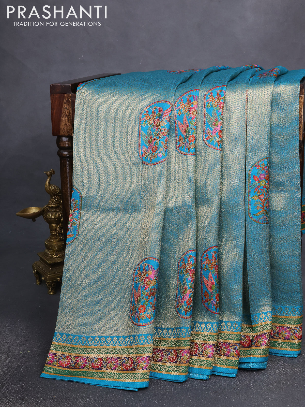 Banarasi silk saree teal blue with position prints and printed border