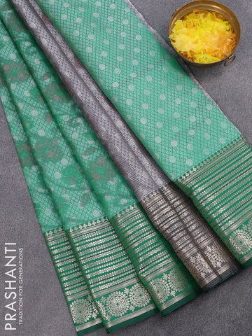 Banarasi kora saree green shade with allover ikat weaves and long zari woven border