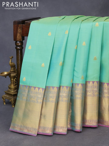 Pure kanchipuram silk saree teal green shade and pink with zari woven buttas and long zari woven border