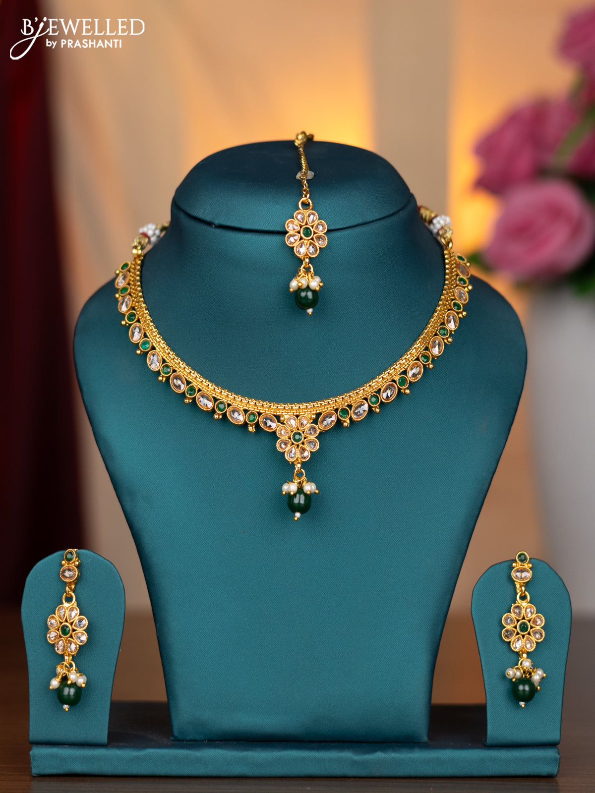 Antique necklace with emerald & cz stones and green beads hanging with maang tikka