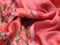 Pure linen saree peach pink and rustic orange with allover floral prints and silver zari woven piping border