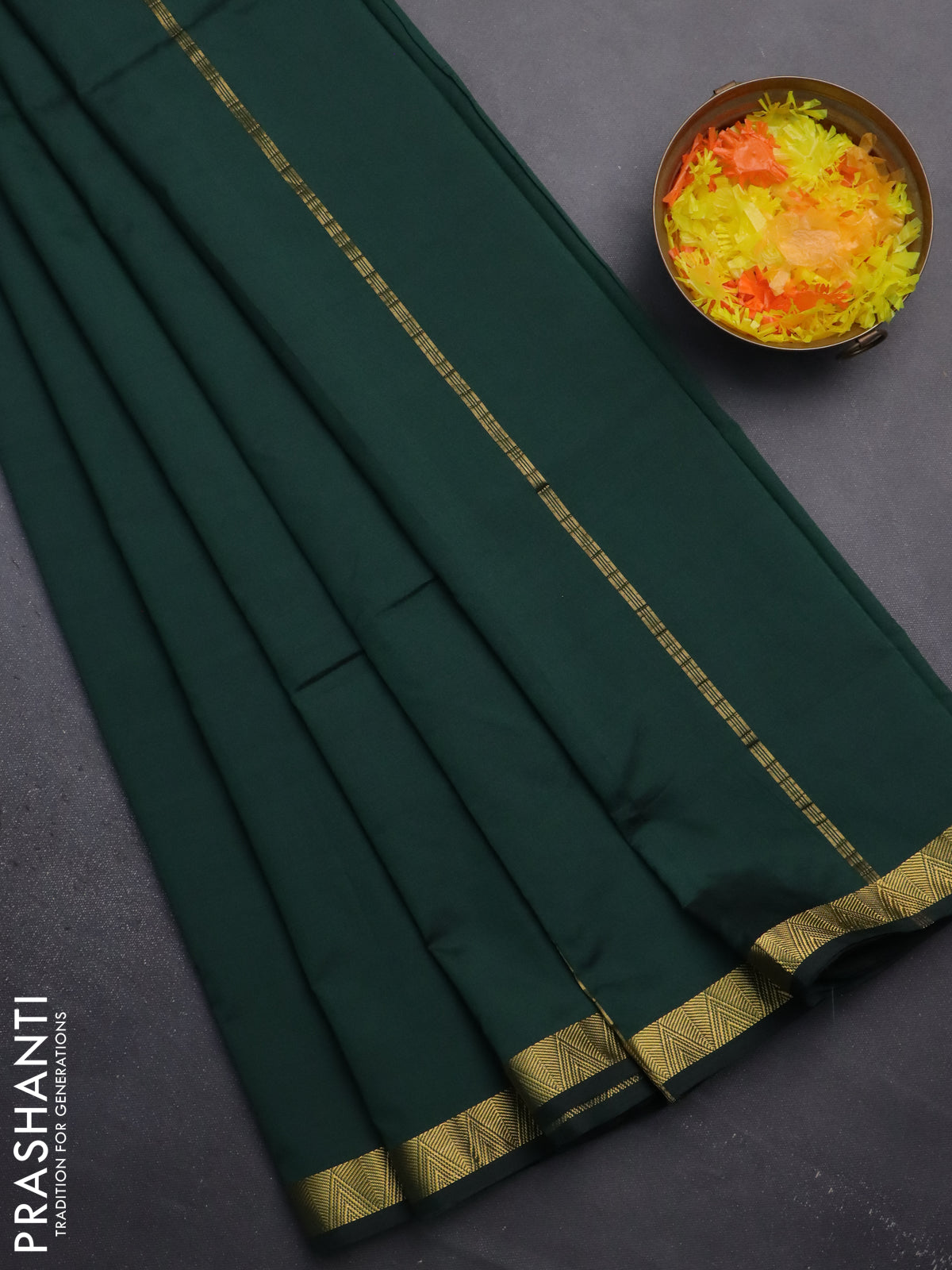 Arani semi silk saree bottle green with plain body and zari woven border