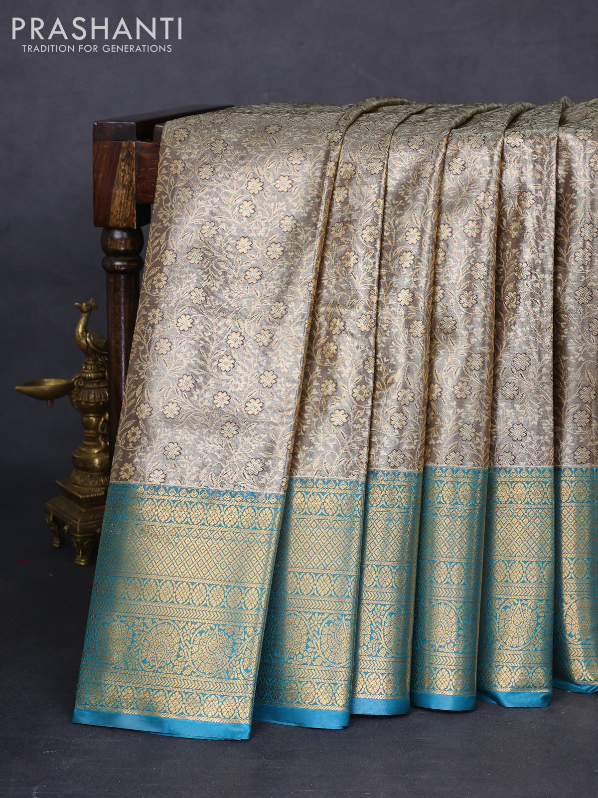 Bangalori tissue silk saree grey shade and peacock blue with allover zari woven brocade weaves and long zari woven border