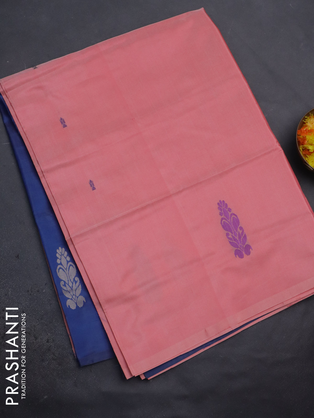Banana pith saree peach shade and blue with thread woven buttas in borderless style