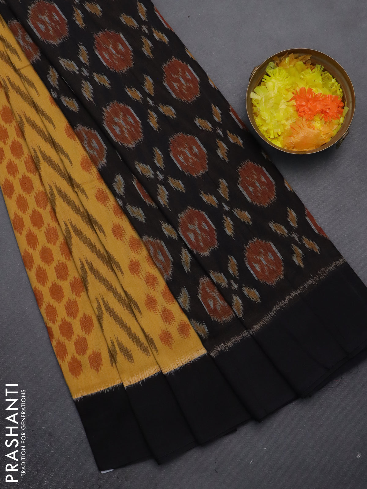 Ikat cotton saree yellow and black with allover ikat weaves and simple border