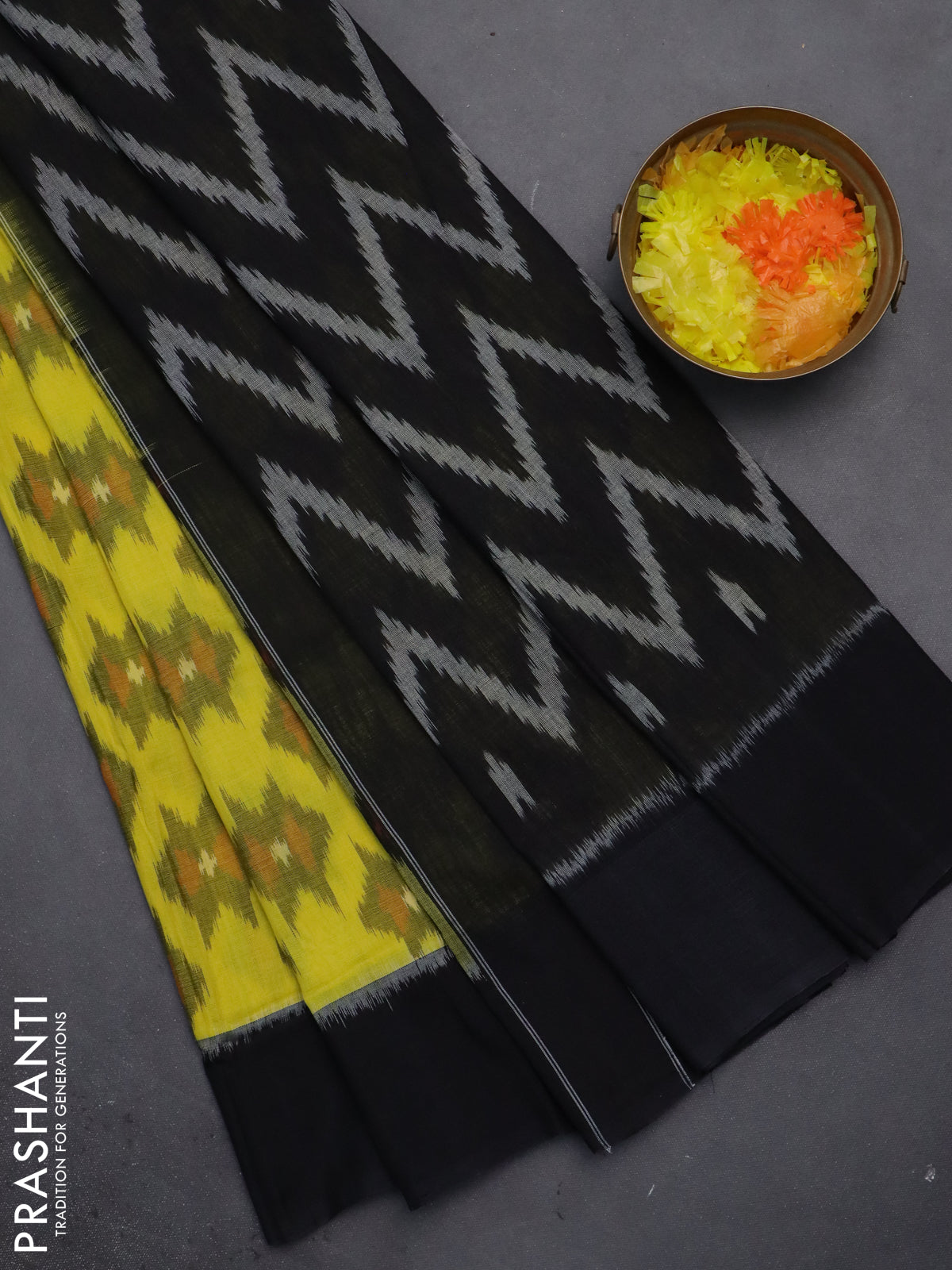 Ikat cotton saree yellow and black with allover ikat butta weaves and simple border