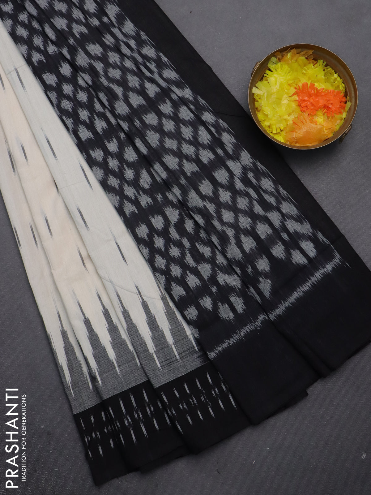 Ikat cotton saree off white and black with allover ikat butta weaves and temple design simple border