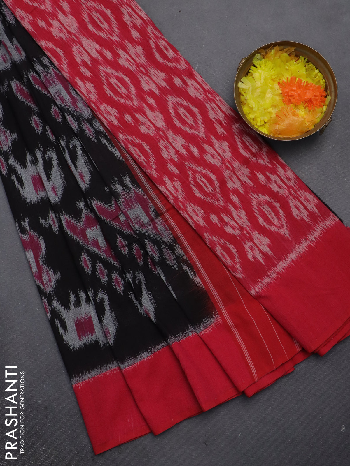 Ikat cotton saree black and pink with allover ikat weaves and simple border