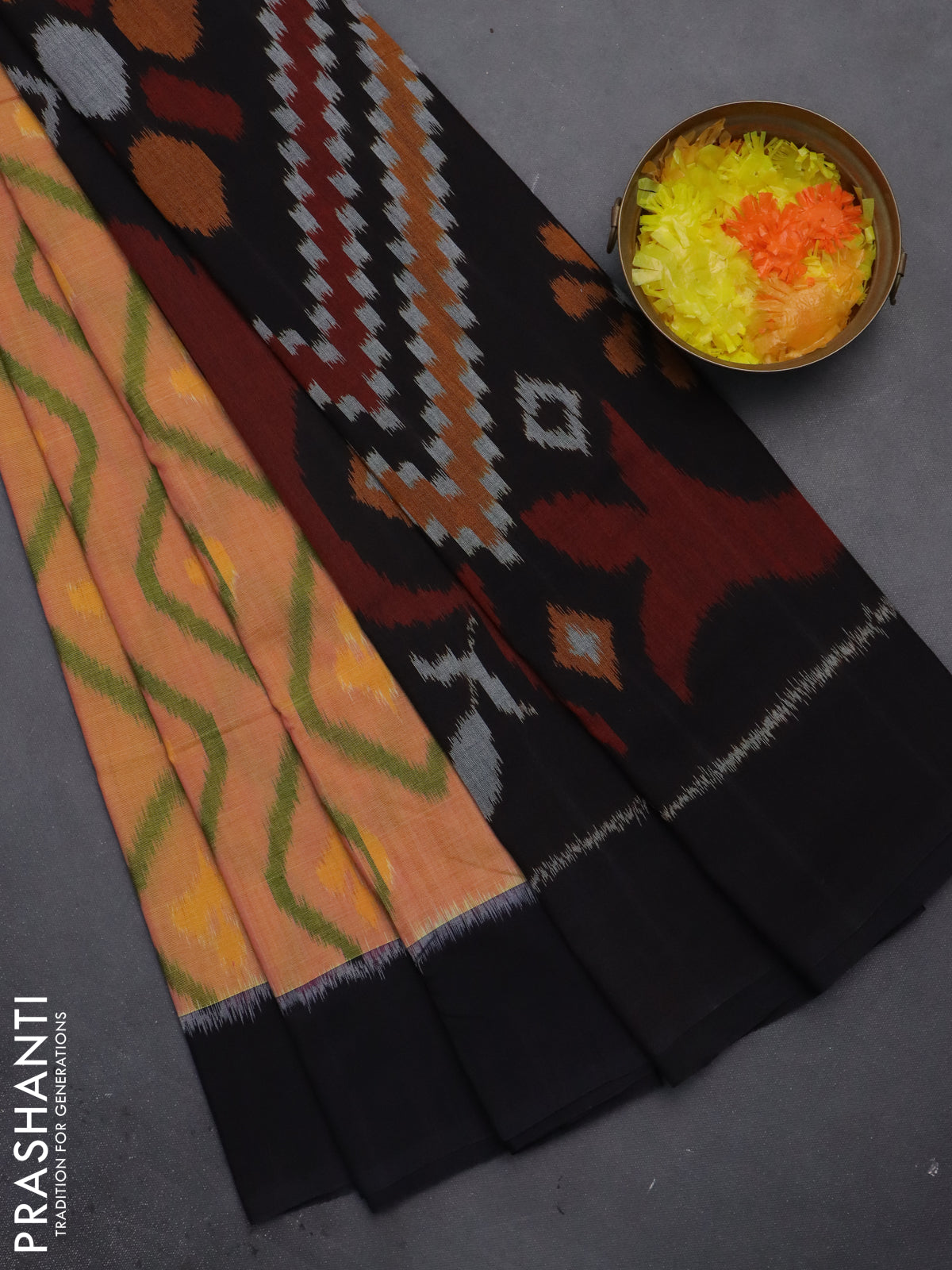 Ikat cotton saree dual shade of yellowish pink and black with allover ikat butta weaves and simple border