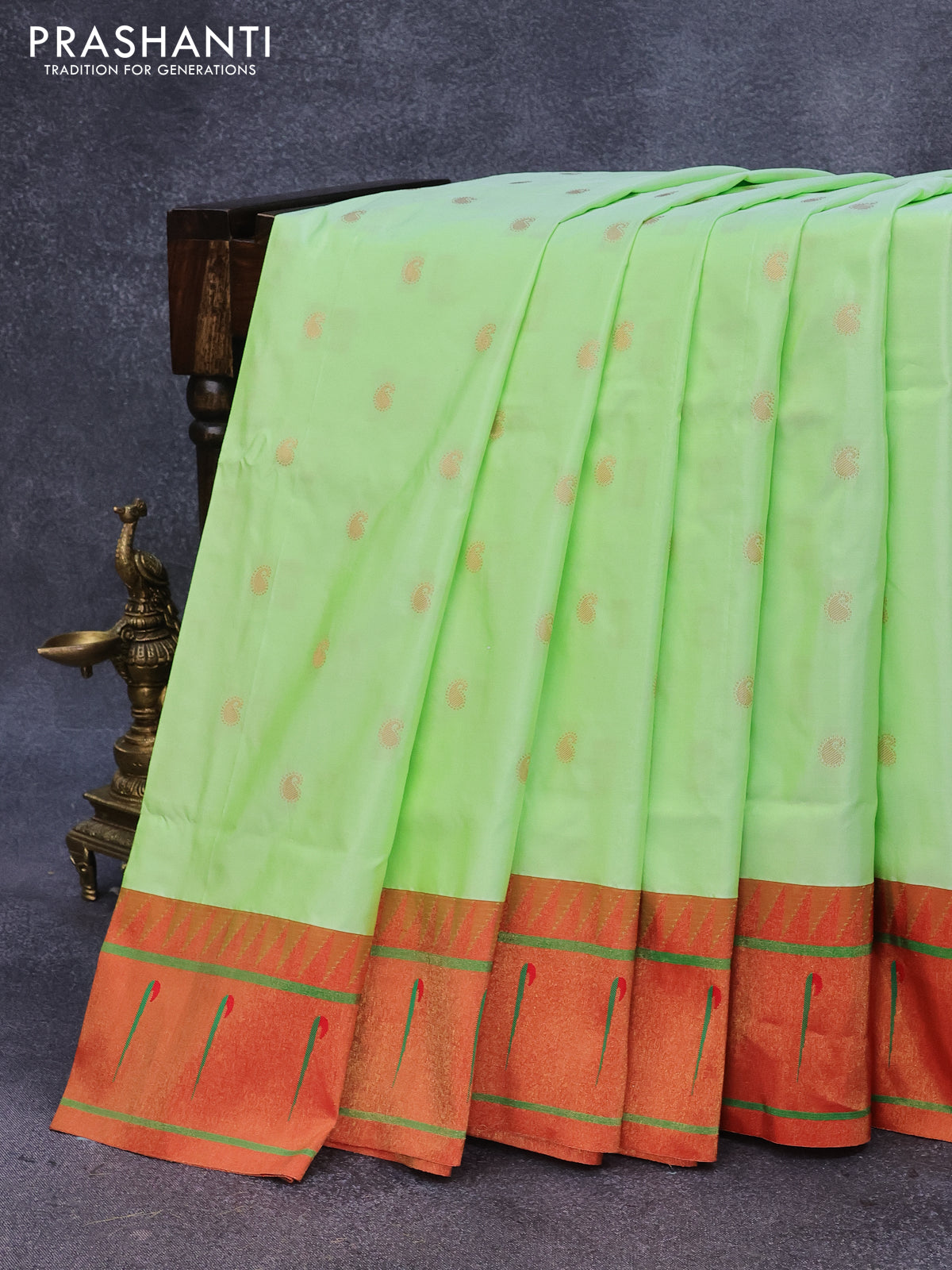 Pure paithani silk saree pista green and red with allover paisley zari woven buttas and zari woven muniya butta border