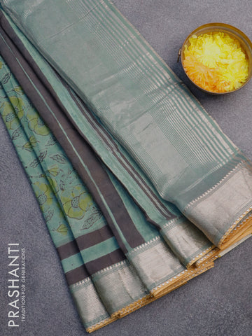 Chanderi silk cotton saree pastel green shade and mustard yellow with natural vegetable prints and zari woven gotapatti lace border