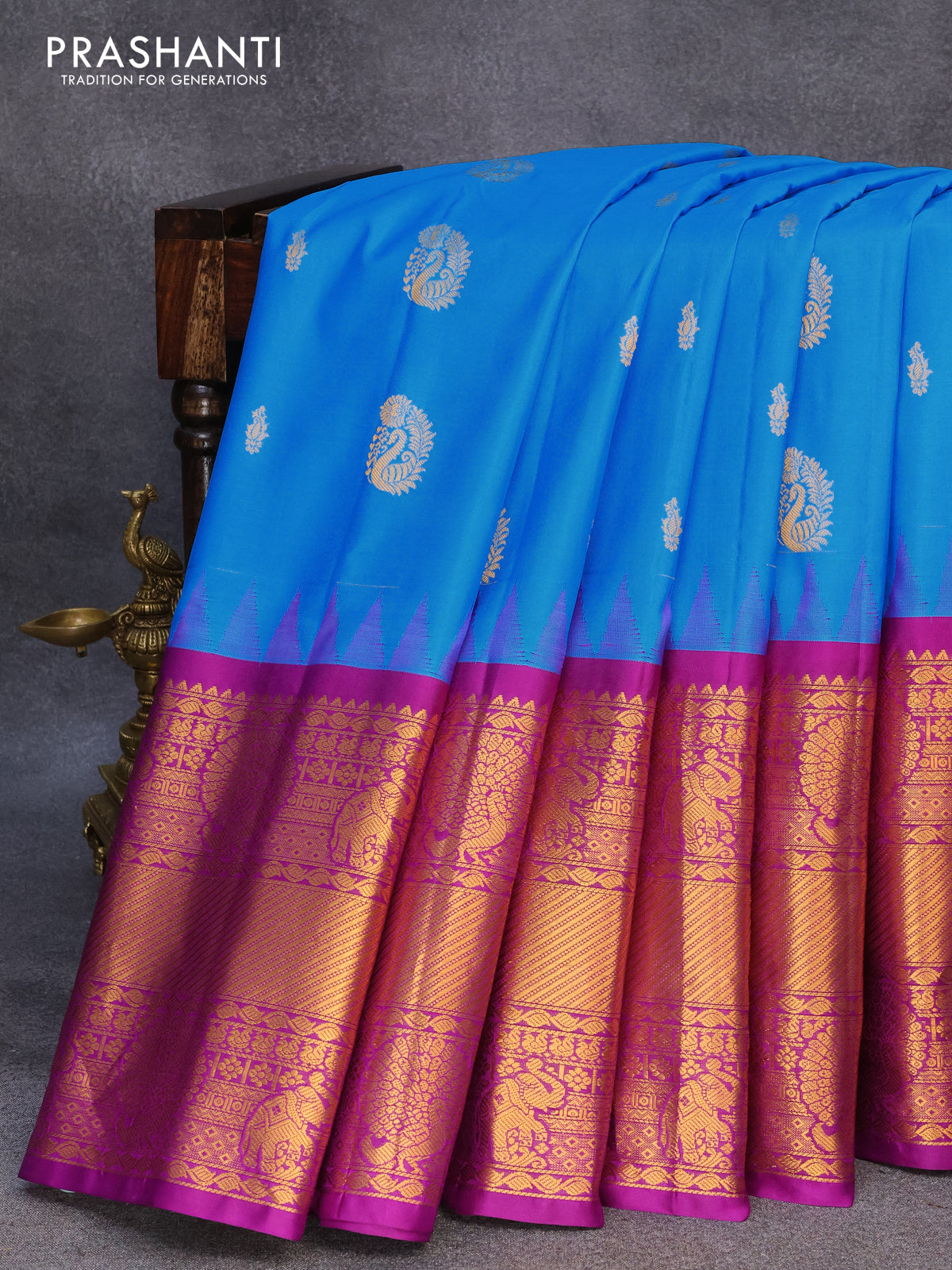 Pure gadwal silk saree cs blue and purple with allover zari woven buttas and temple design long elephant & peacock zari woven border