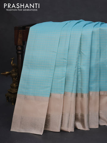 Pure soft silk saree light blue and beige with allover checked pattern and rettapet silver zari woven border