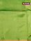 Banana silk saree light green with batik butta prints and small zari woven border