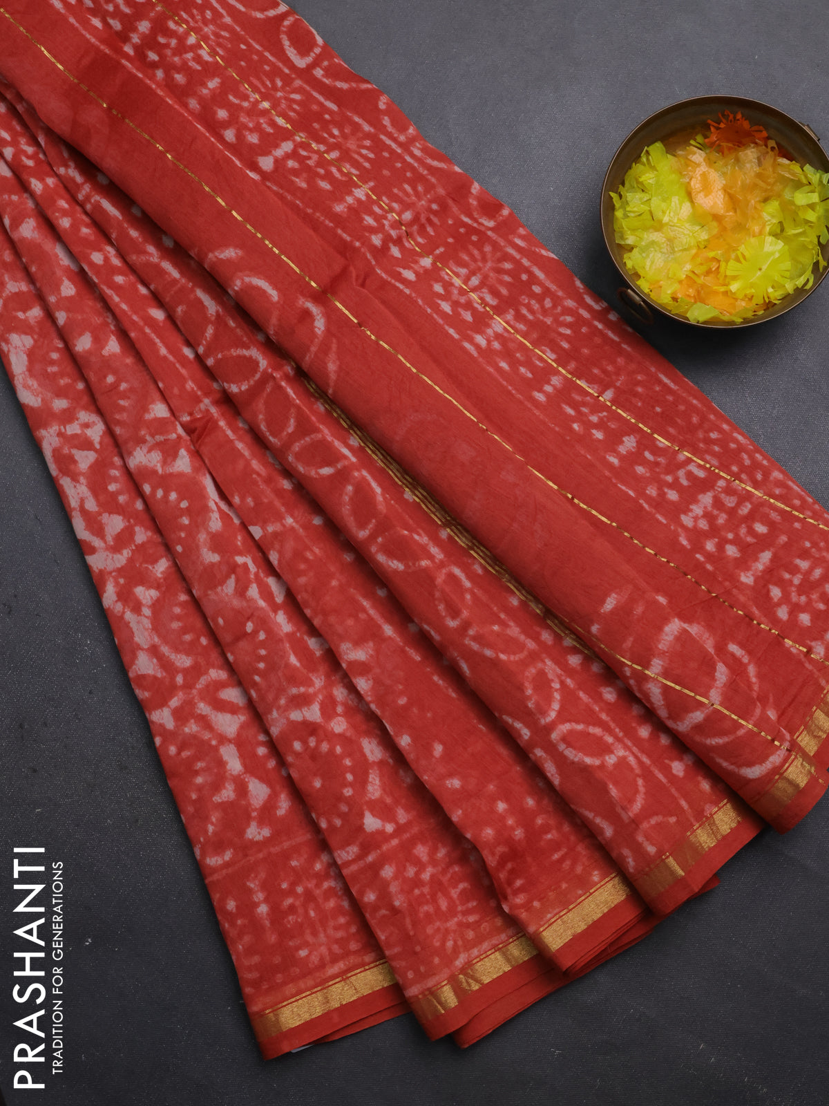 Chanderi bagru saree orange with allover dabu prints and small zari woven border