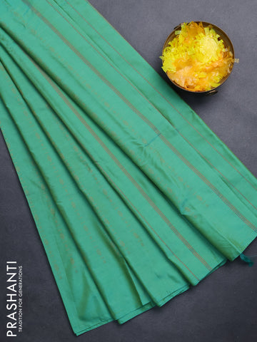 Arani semi silk saree green with allover copper zari weaves in borderless style