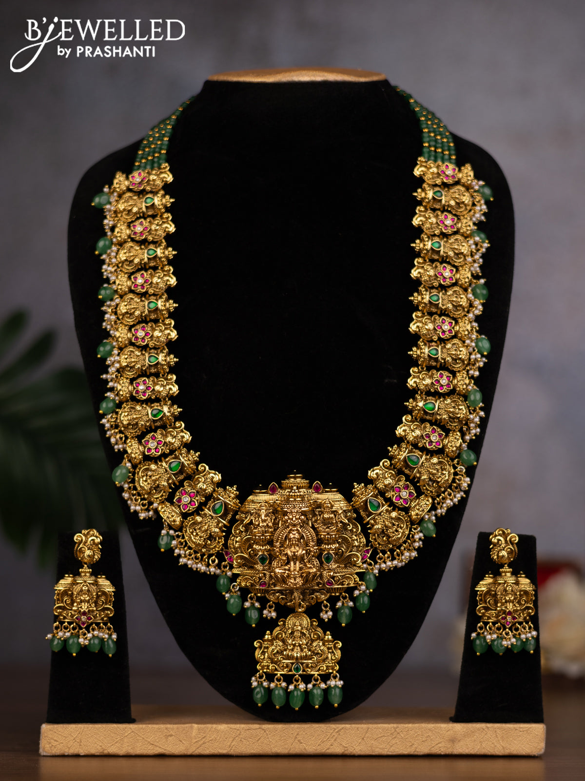 Antique haaram lakshmi design with kemp & kundan stones and green beads hanging