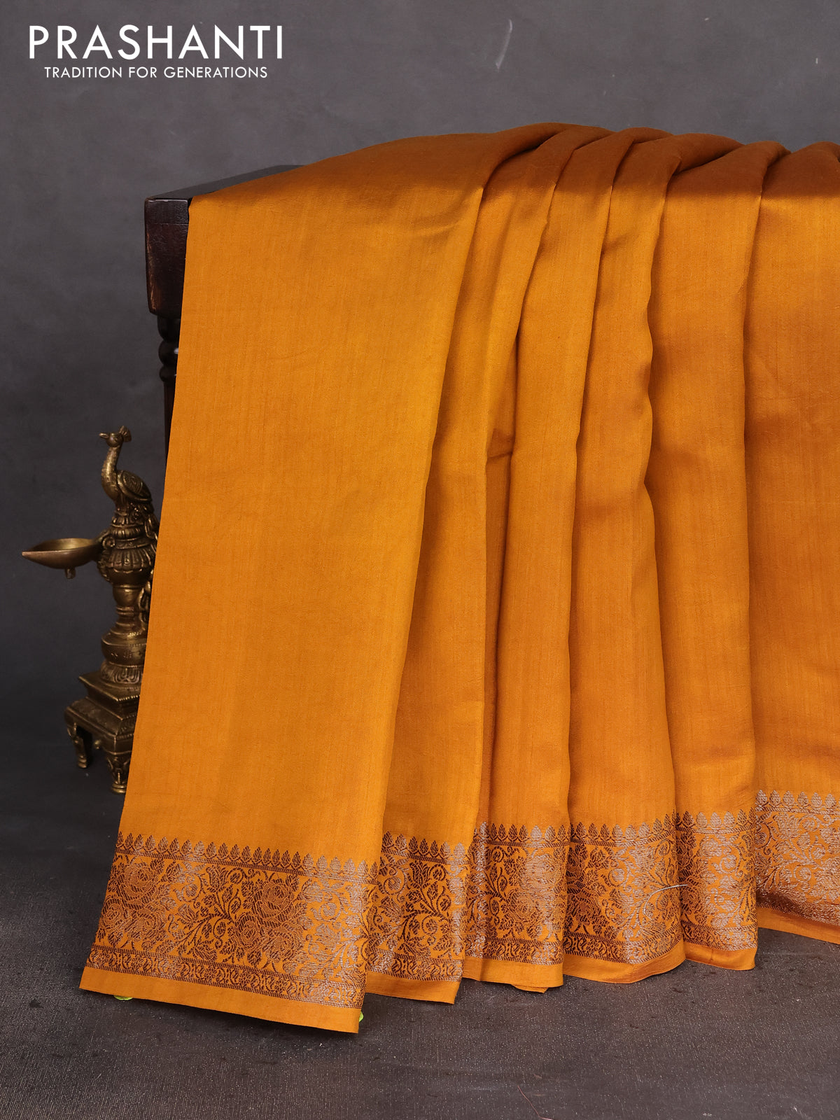Chiniya silk saree dark mustard with plain body and woven border