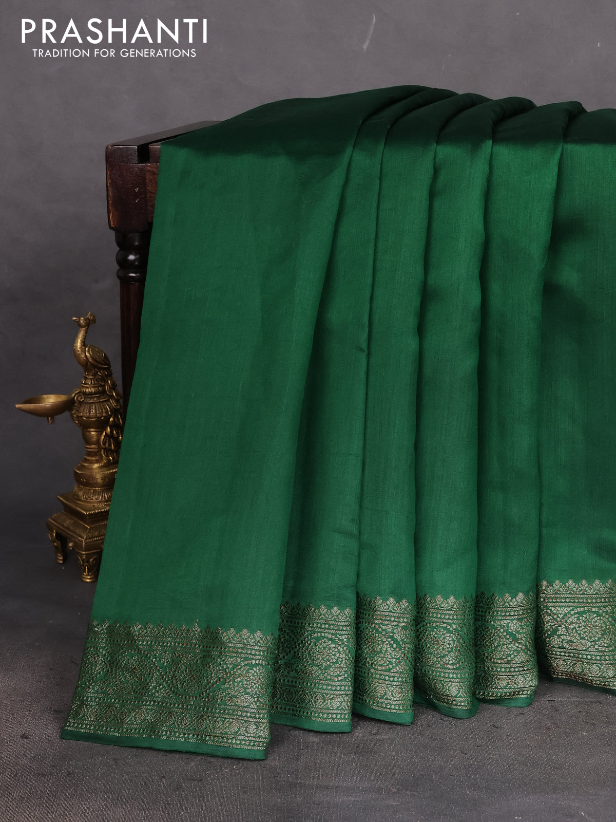 Chiniya silk saree green with plain body and woven border