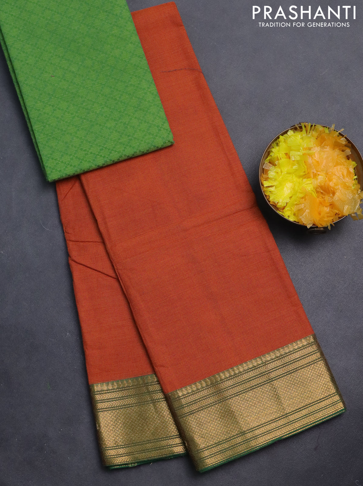 Chettinad cotton saree rust shade and green with allover small checked pattern and zari woven border