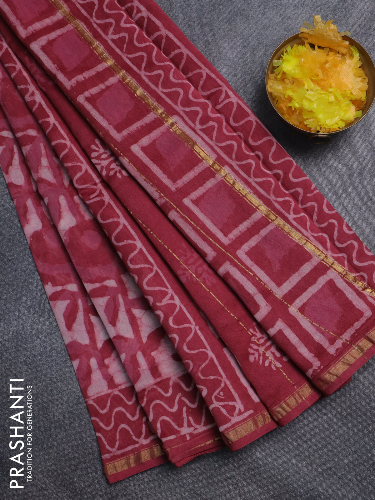 Chanderi bagru saree off white and maroon shade with allover batik prints and small zari woven border