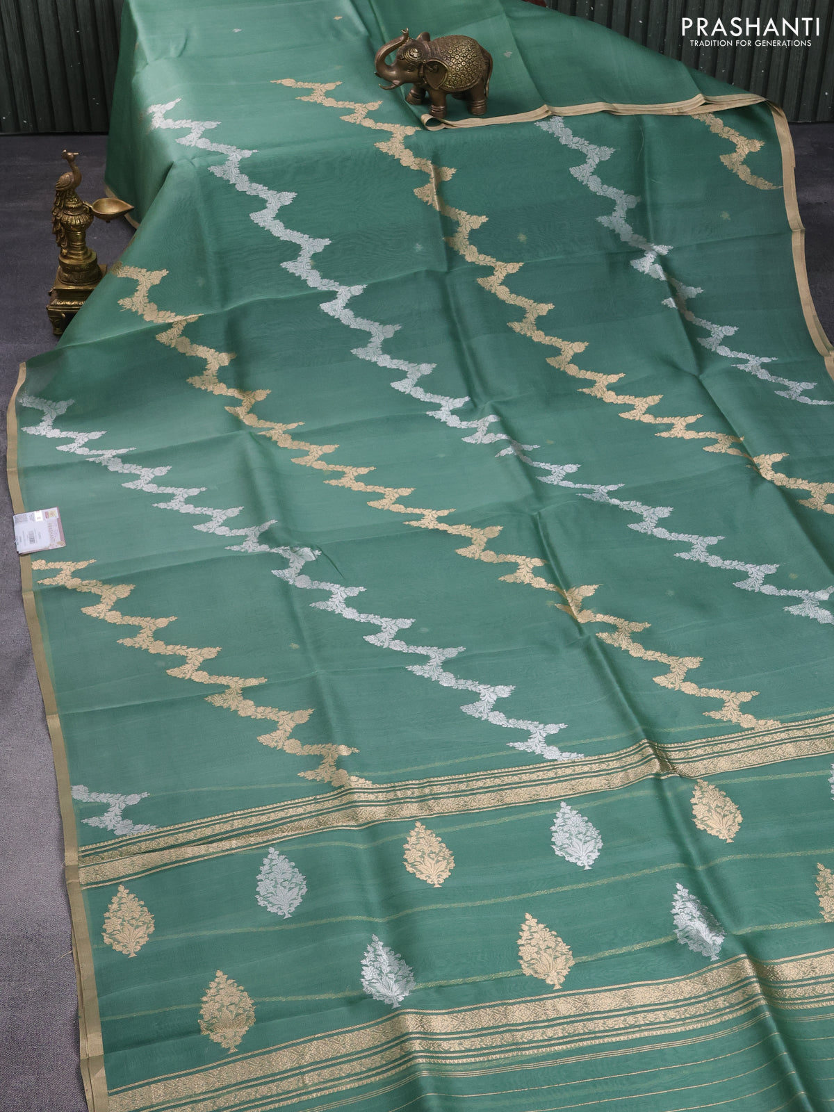 Banarasi organza silk saree pastel green with silver & gold zari weaves and zari woven piping border