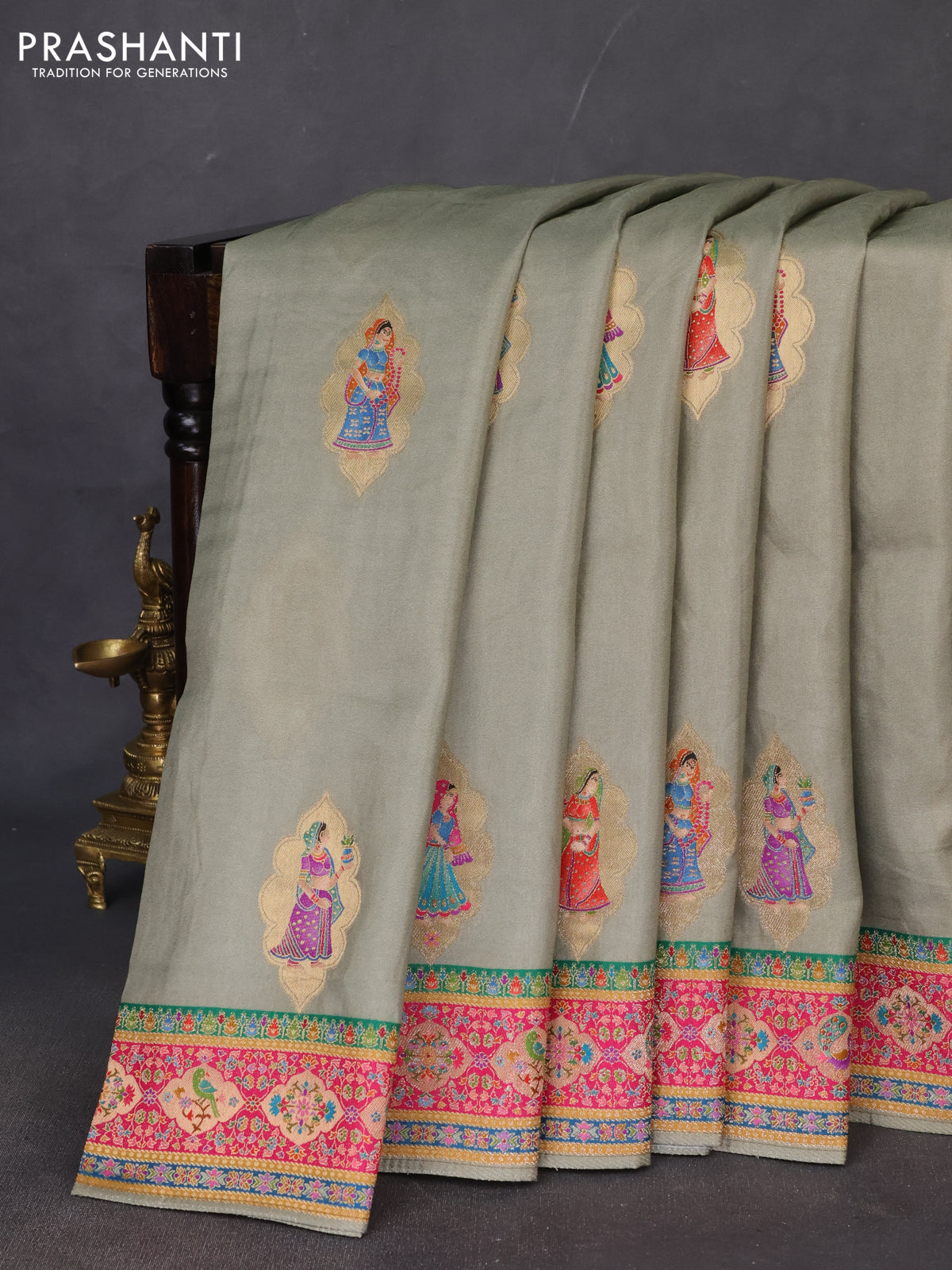 Banarasi silk saree elaichi green with position butta prints and position prints