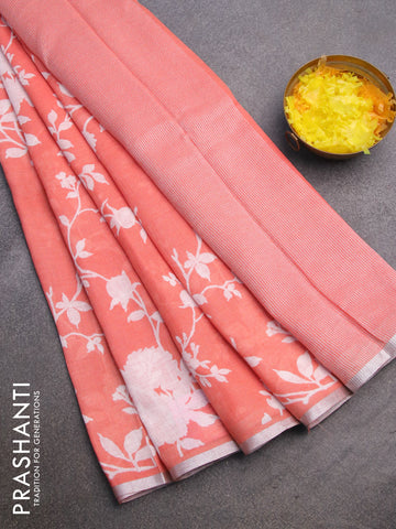 Pure linen saree peach orange with allover floral prints and silver zari woven piping border