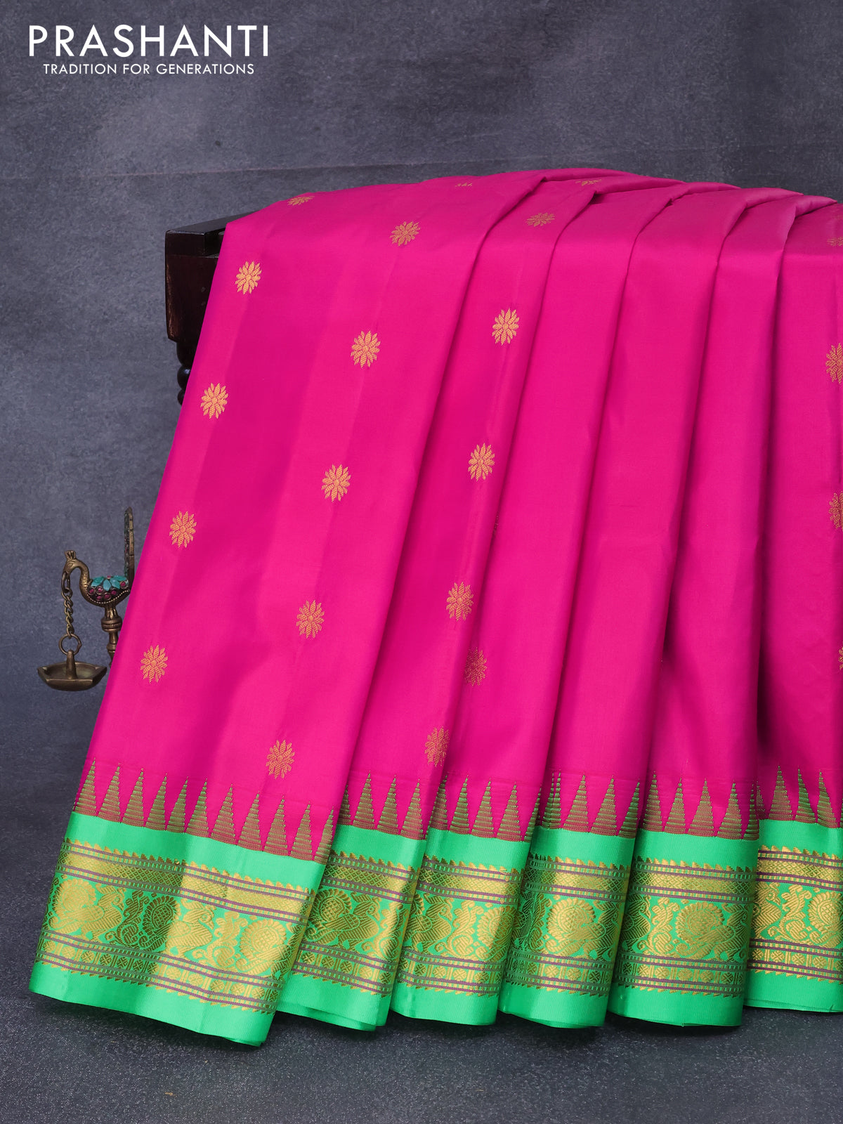 Pure gadwal silk saree pink and light green with allover zari woven floral buttas and temple design annam zari woven border