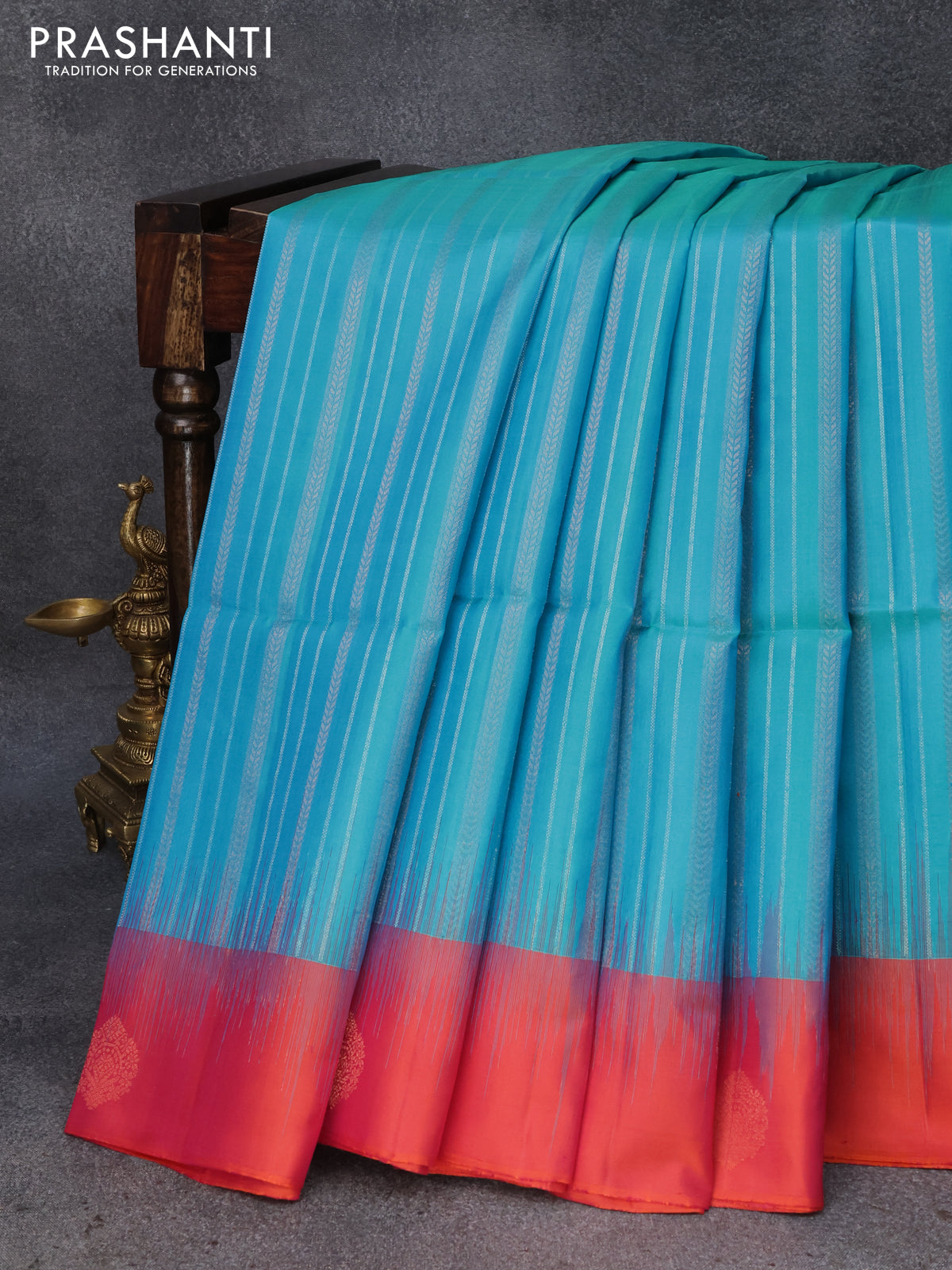 Pure soft silk saree dual shade of cs blue and dual shade of pinkish orange with silver & copper zari weaves and zari woven butta border