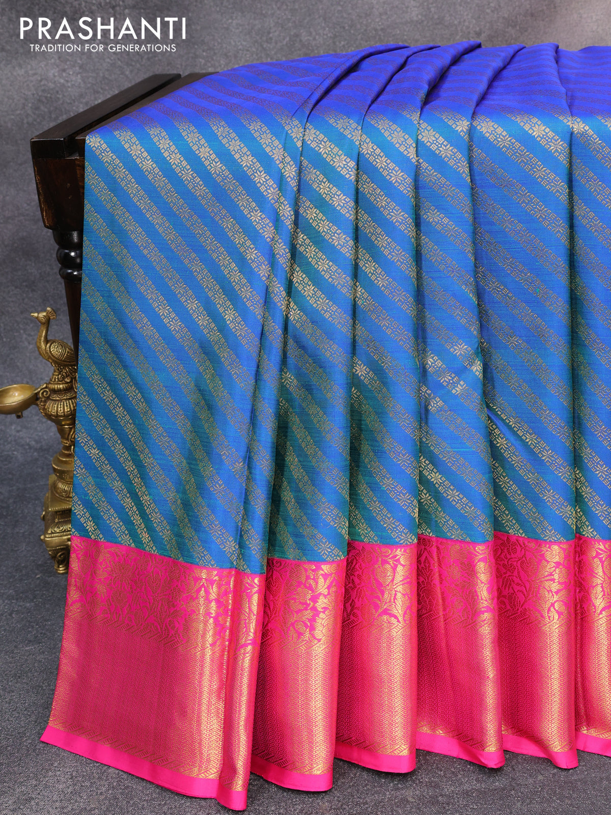 Pure kanjivaram silk saree dual shade of bluish green and pink with allover zari weaves and rich floral zari woven border