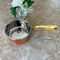 copper saucepan with brass handle