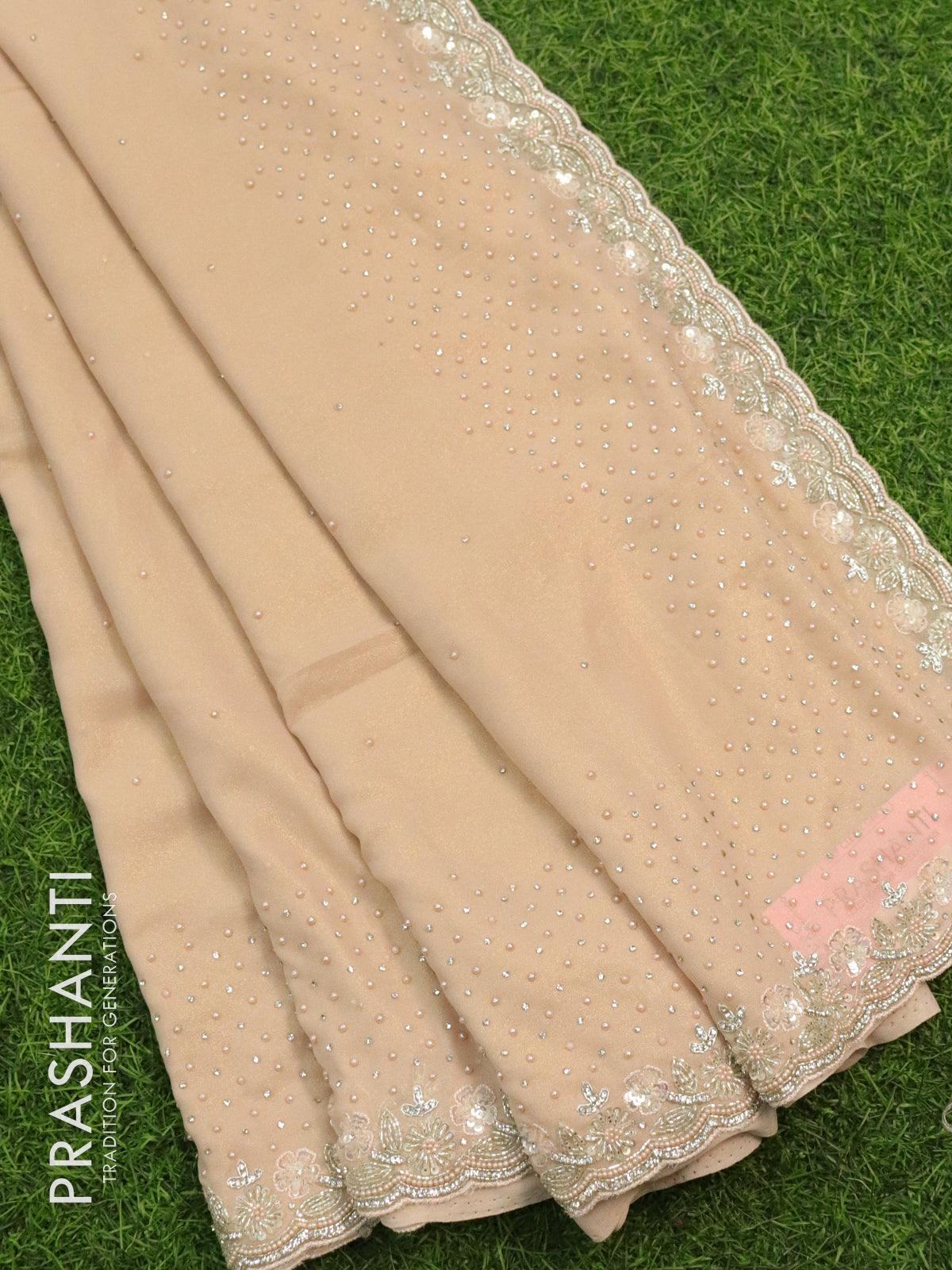 Designer georgette saree pastel peach with allover stone & zardosi work