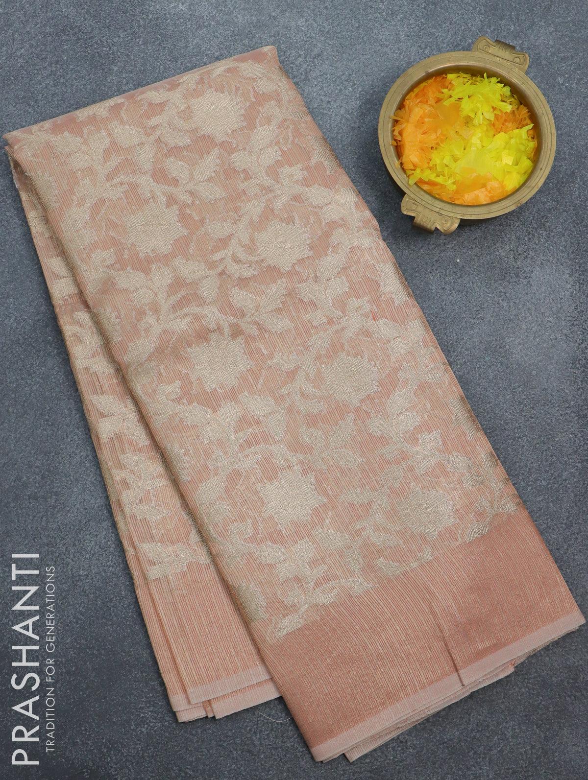 Kota tissue saree peach orange with allover zari weaves and zari woven border