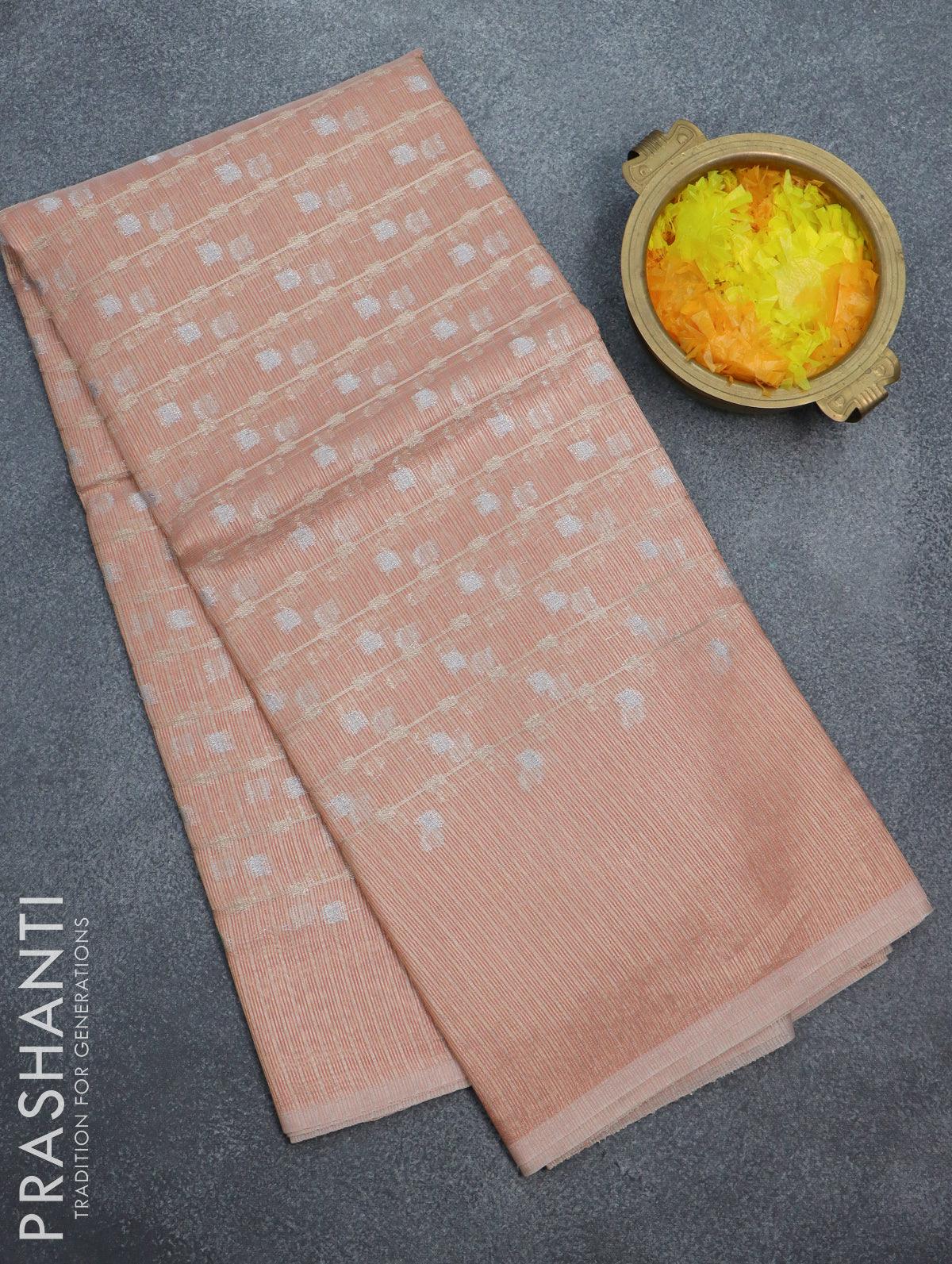 Kota tissue saree peach orange with allover zari weaves and zari woven border