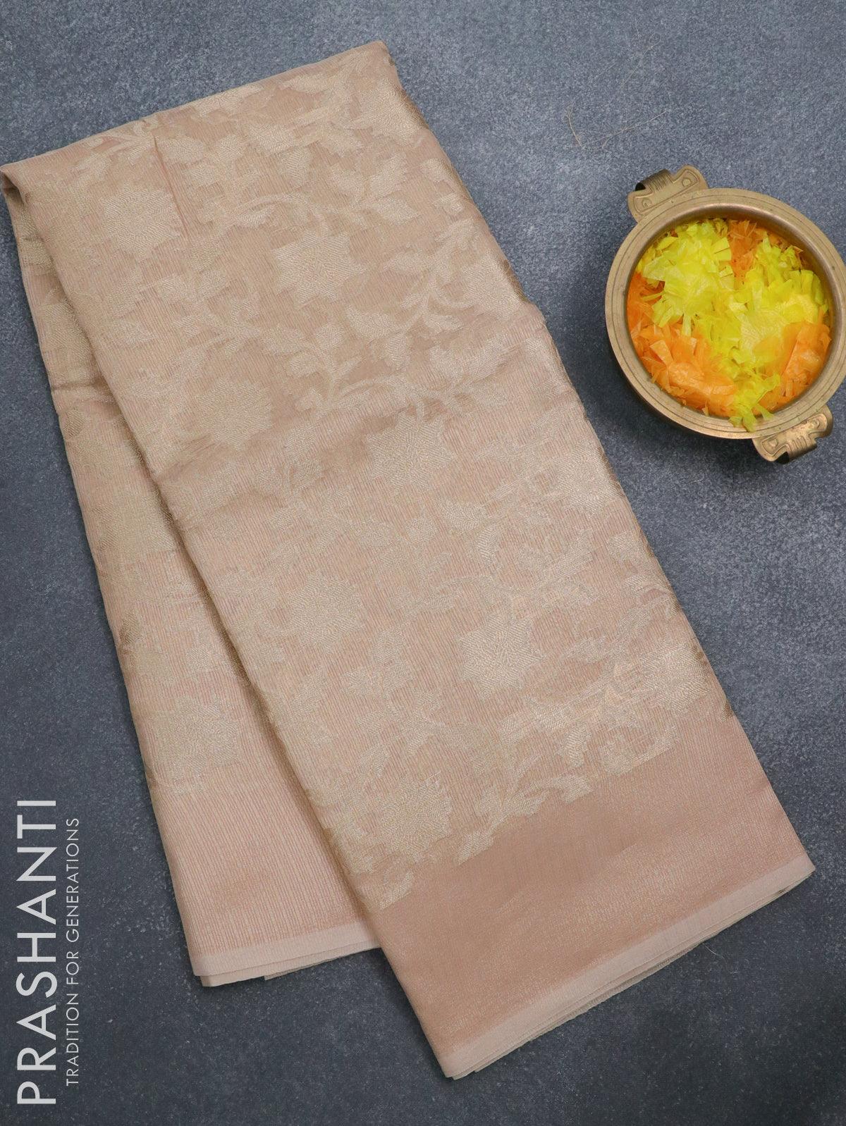 Kota tissue saree peach with allover zari weaves and zari woven border