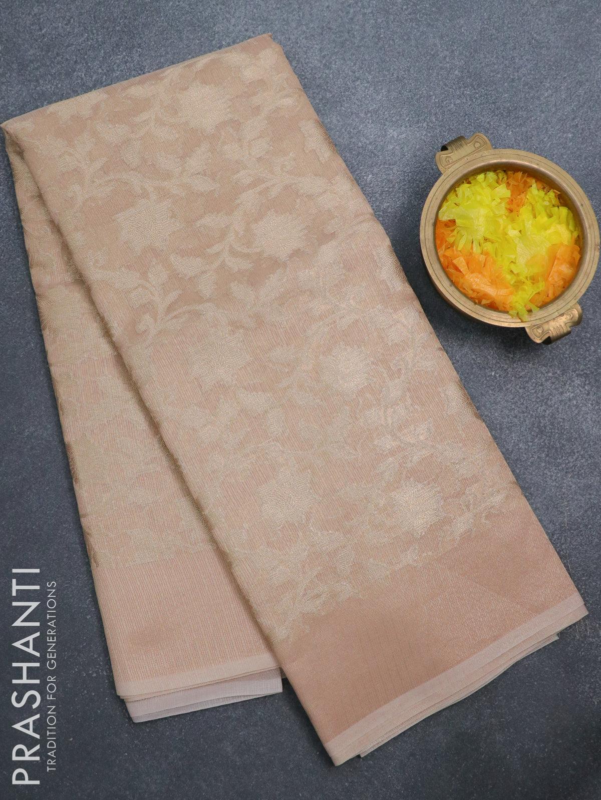 Kota tissue saree peach with allover zari weaves and zari woven border