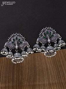 Oxidised jhumka peacock design with emerald stones and pearl hangings