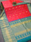 Pure gadwal silk saree dual shade of pinkish orange and teal blue with allover zari woven buttas and temple design long zari woven border