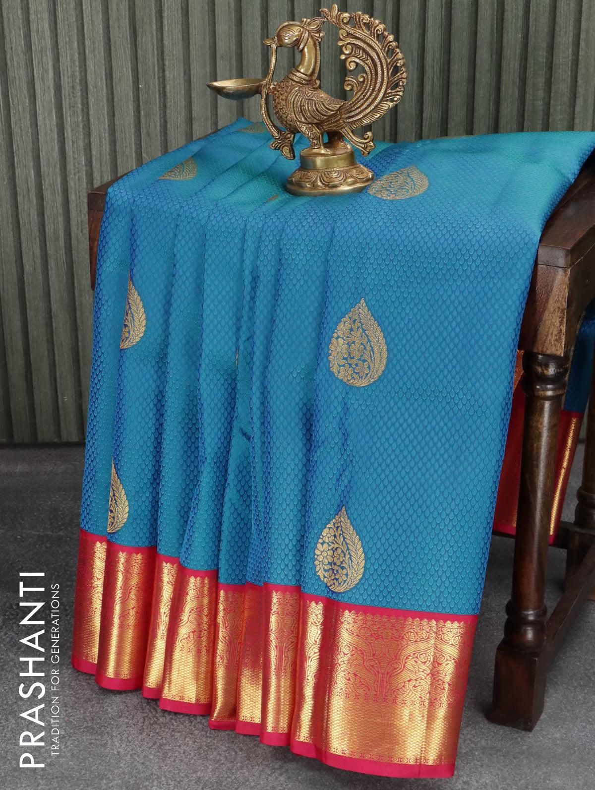Pure kanjivaram silk saree blue and pink with allover self emboss zari buttas and rich zari woven korvai border