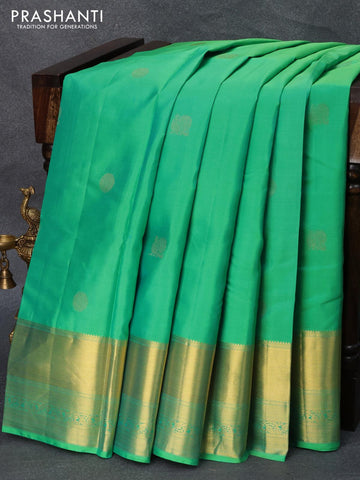 Pure kanjivaram silk saree dual shade of teal green and pink with zari woven buttas and zari woven border