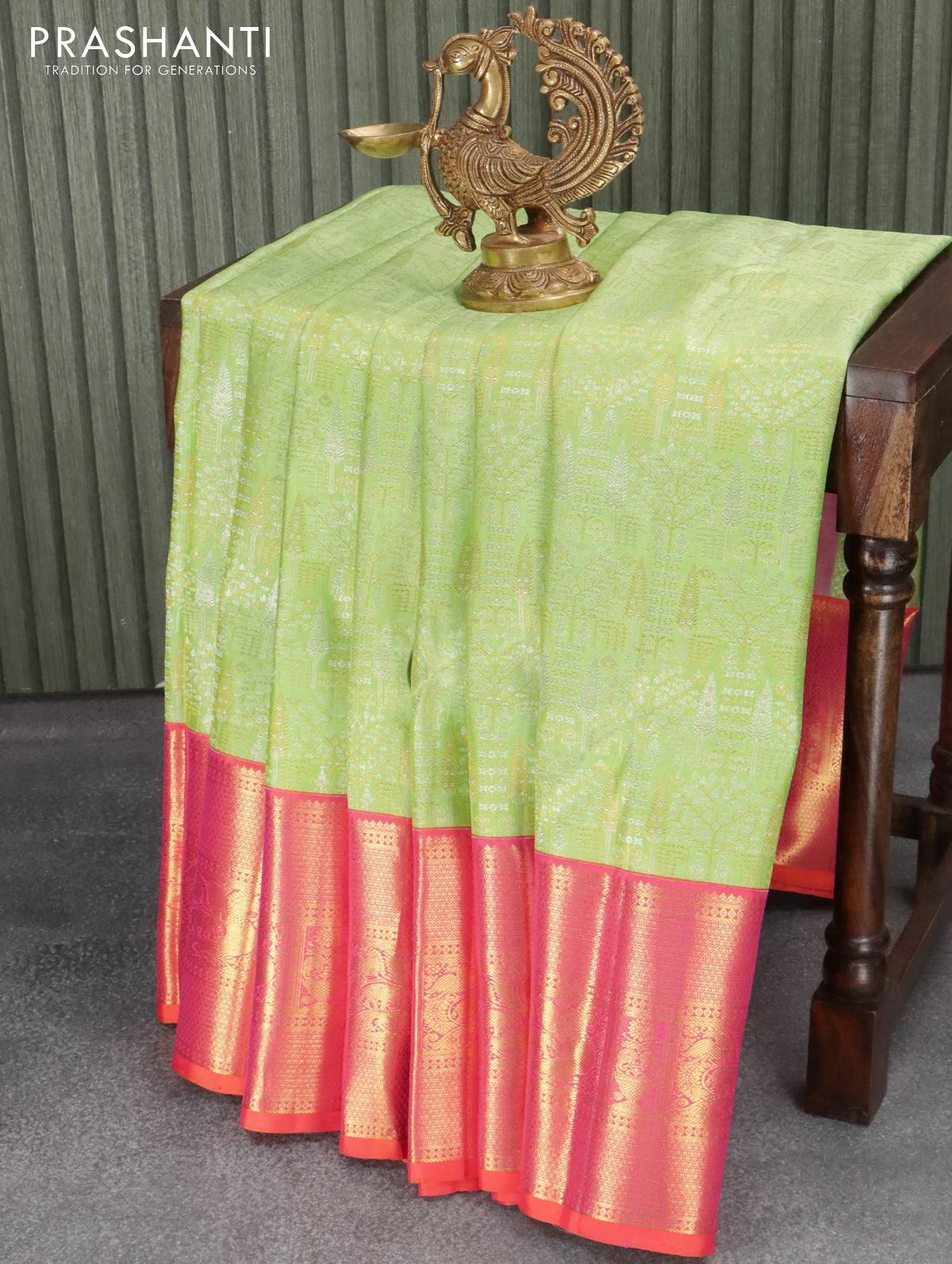 Pure kanjivaram silk saree light green and dual shade of orange with allover zari woven brocade weaves and rich zari woven border