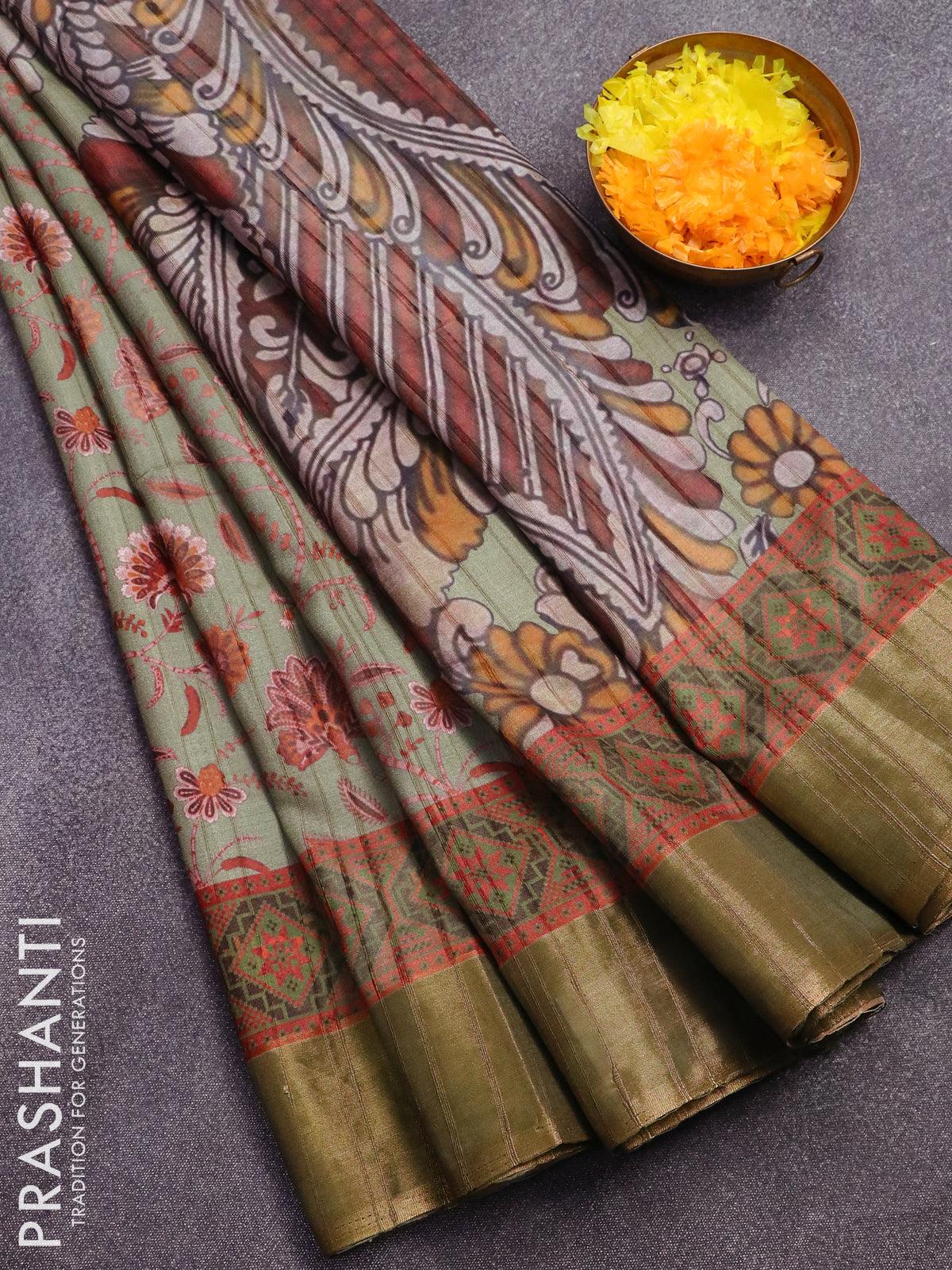 Semi matka saree pastel green shade with allover floral prints and zari woven border