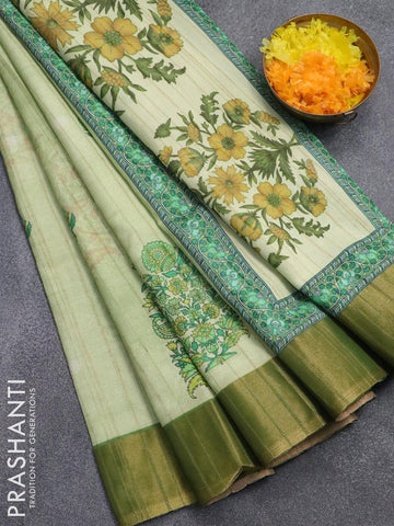 Semi matka saree pista green with floral butta prints and zari woven border