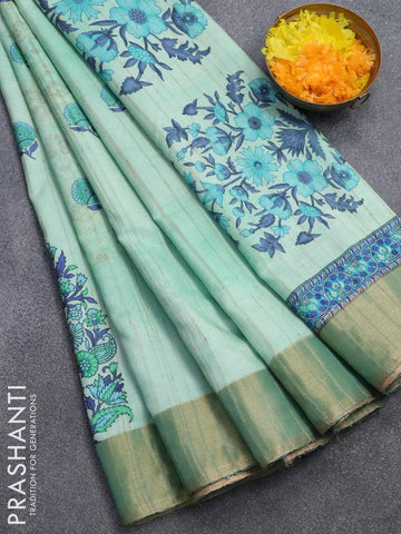 Semi matka saree teal green shade with floral butta prints and zari woven border
